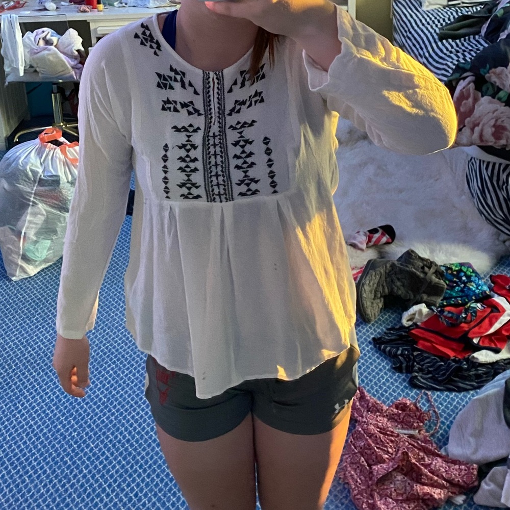 White blouse with grey pattern near the neck!